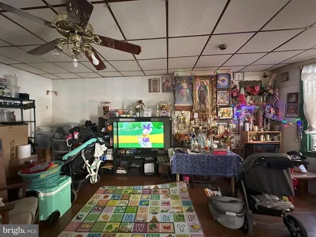 a room with lots of storage and a flat screen tv