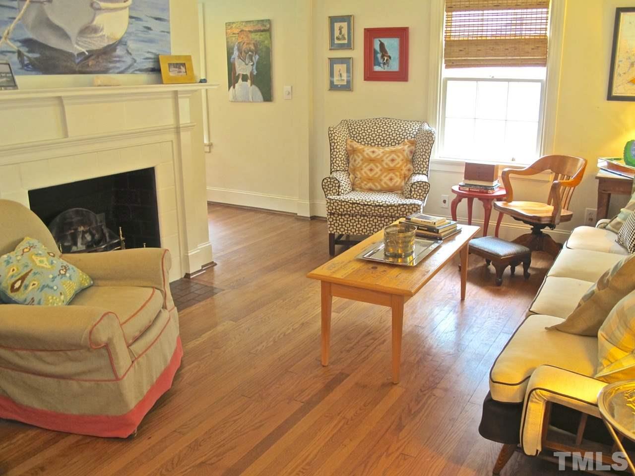 1607 Carson Street Raleigh, NC 27608 - Photo 5 of 16 a living room with furniture and a fireplace