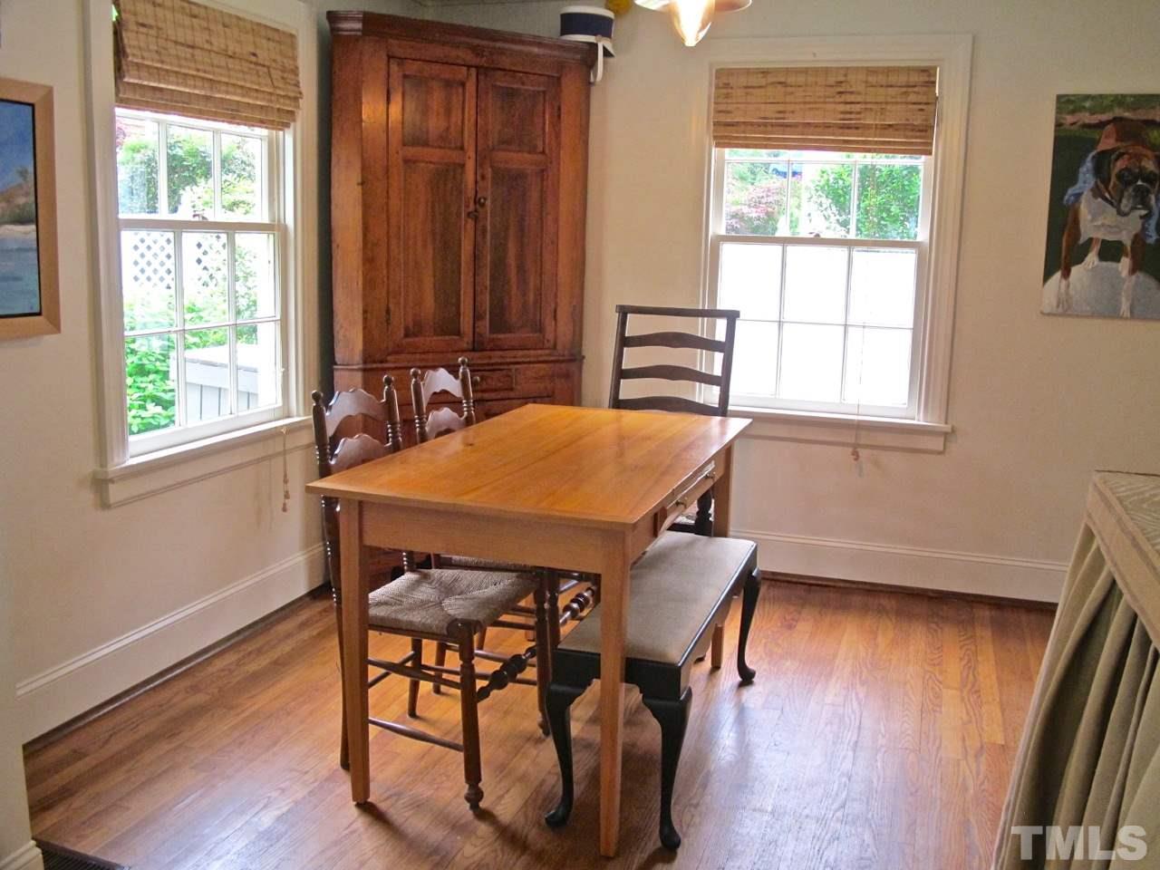 1607 Carson Street Raleigh, NC 27608 - Photo 8 of 16 a view of a dining room with furniture window and wooden floor
