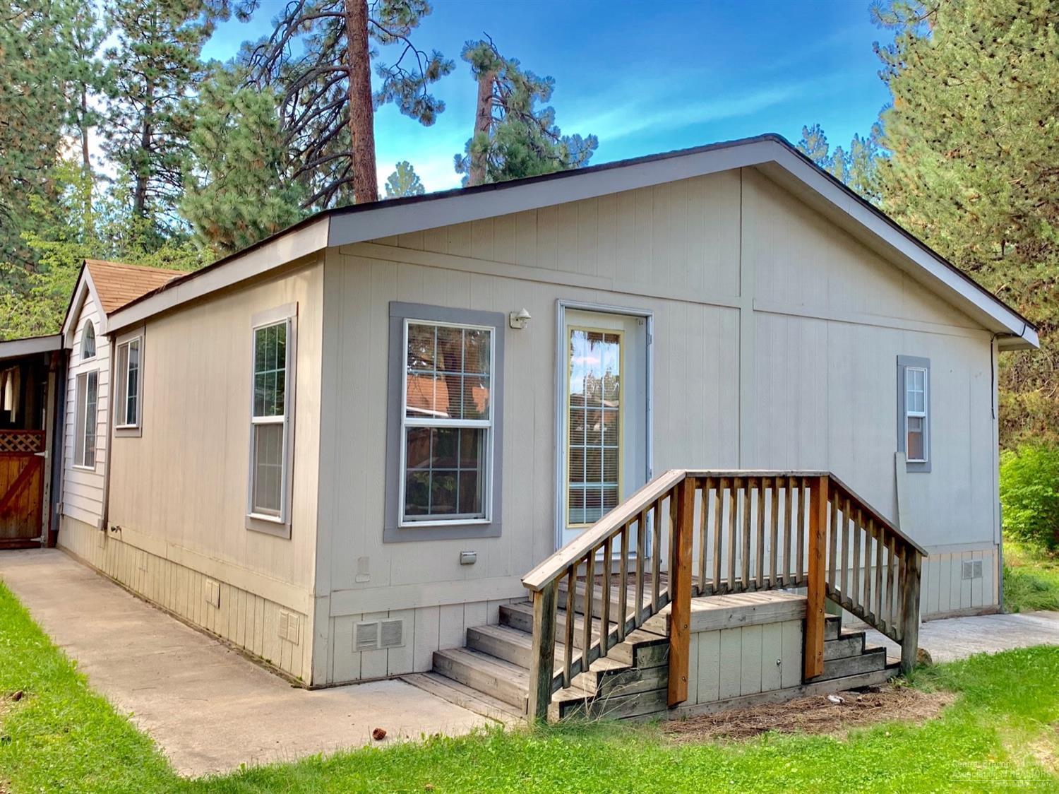 141 Southwest 15th Street, Unit 37 Bend, OR 97702 - Photo 22 of 23 Concrete walkway around home