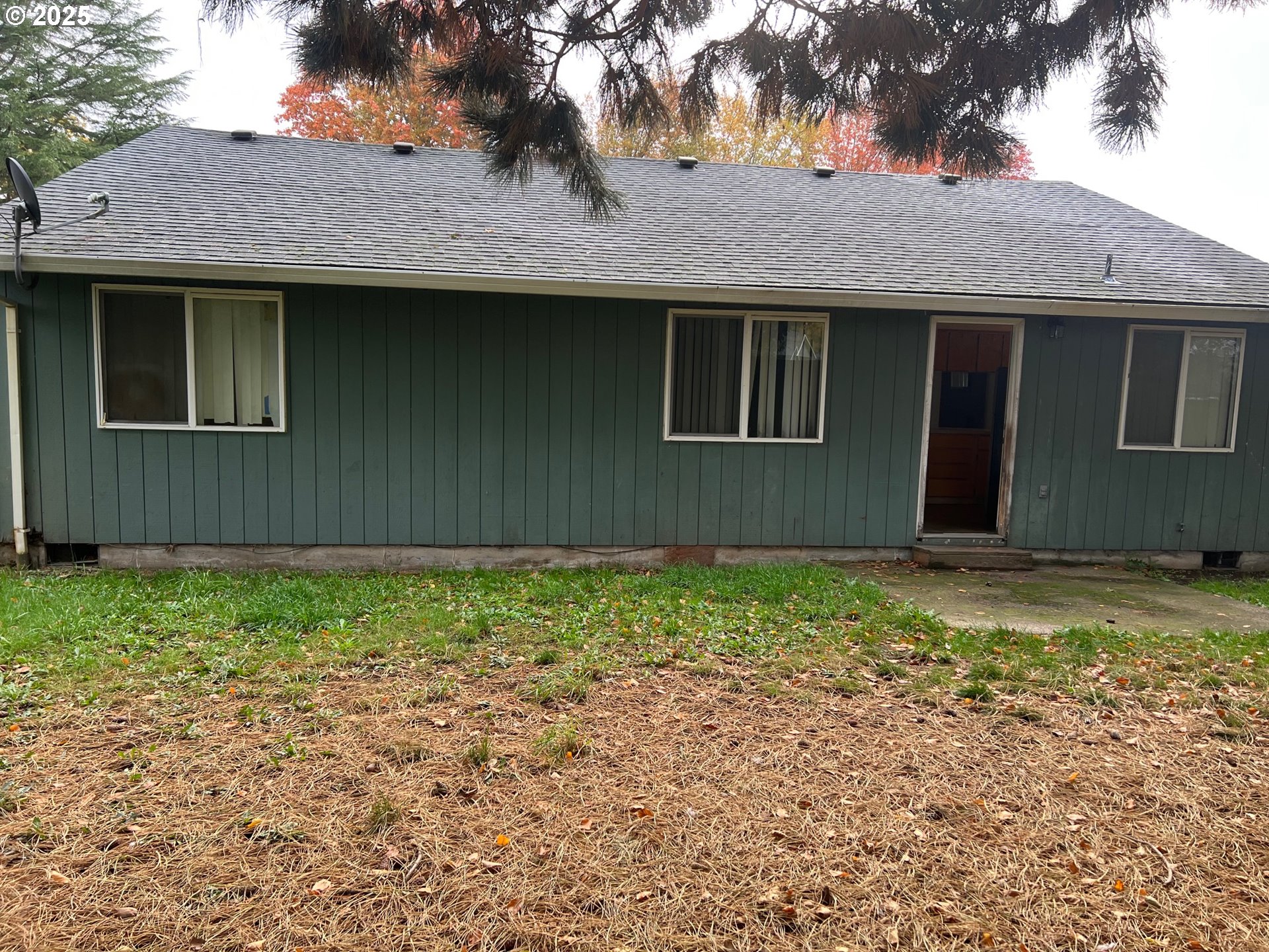 18830 Southwest Butternut Street Beaverton, OR 97078 - Photo 11 of 13 a house with a tree in front of it
