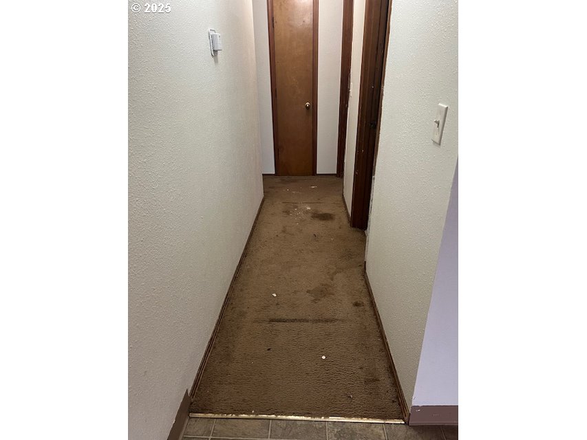 18830 Southwest Butternut Street Beaverton, OR 97078 - Photo 5 of 13 a view of a hallway with white walls
