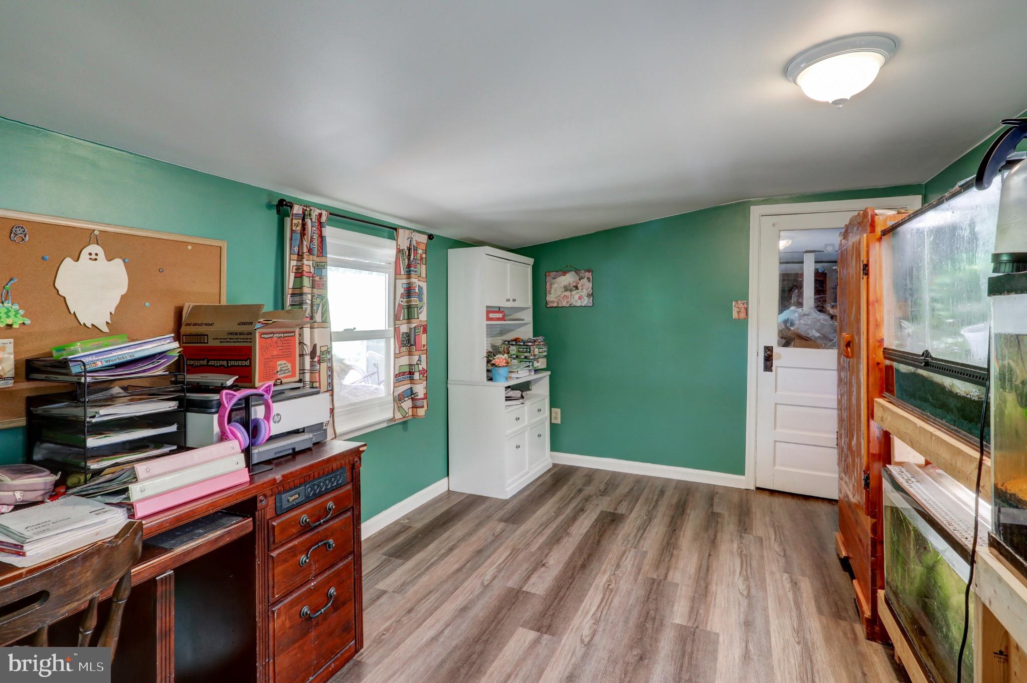 3472 Messersmith Road York, PA 17408 - Photo 32 of 41 Cozy green room with natural light.