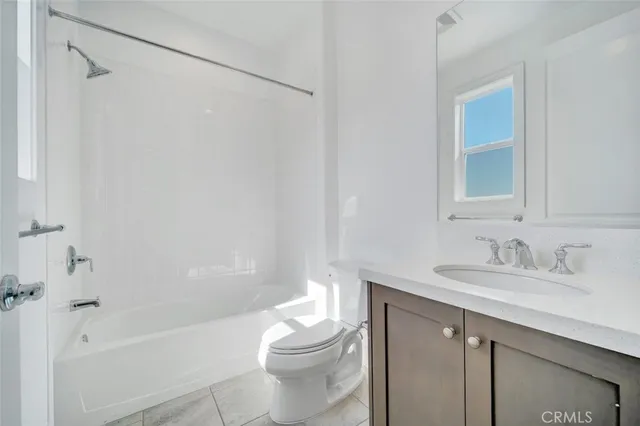 a bathroom with 2 sink and a bathtub
