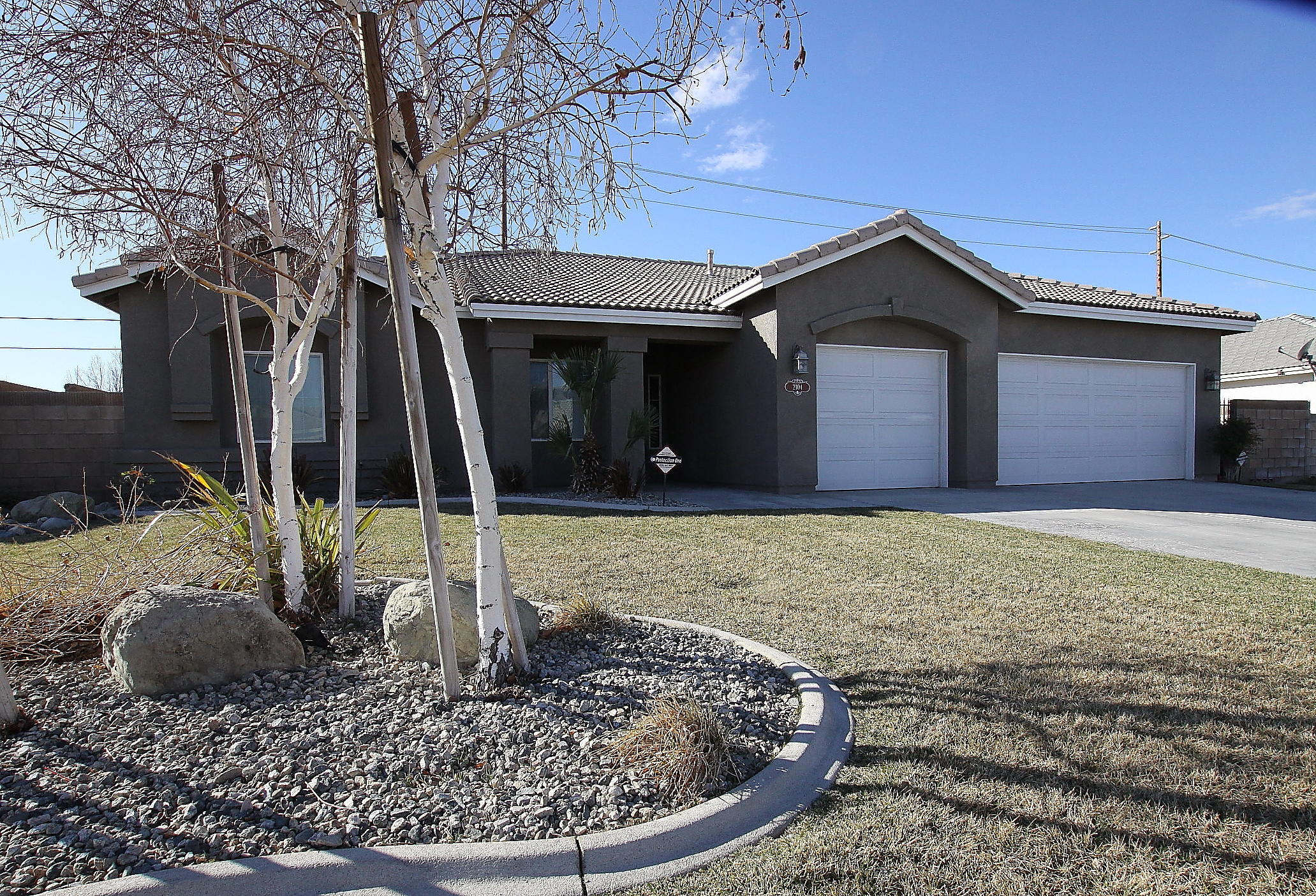 a view of a house with a small yard