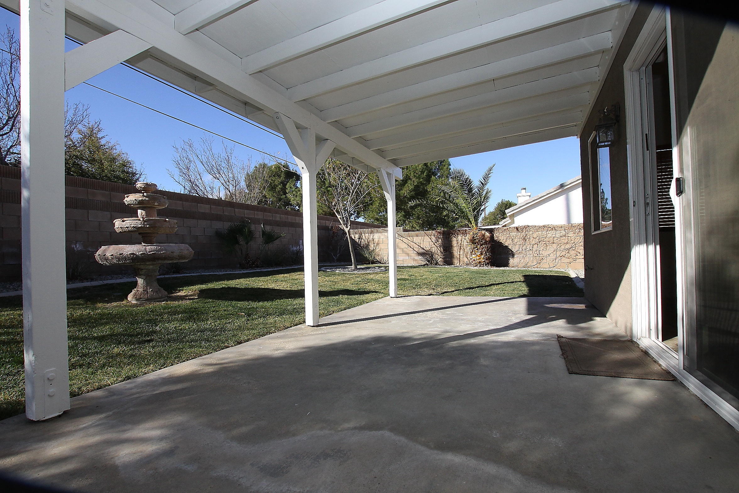2104 Avenue J7 W Lancaster Ca West Lancaster, CA 93536 - Photo 16 of 18 a view of backyard with porch