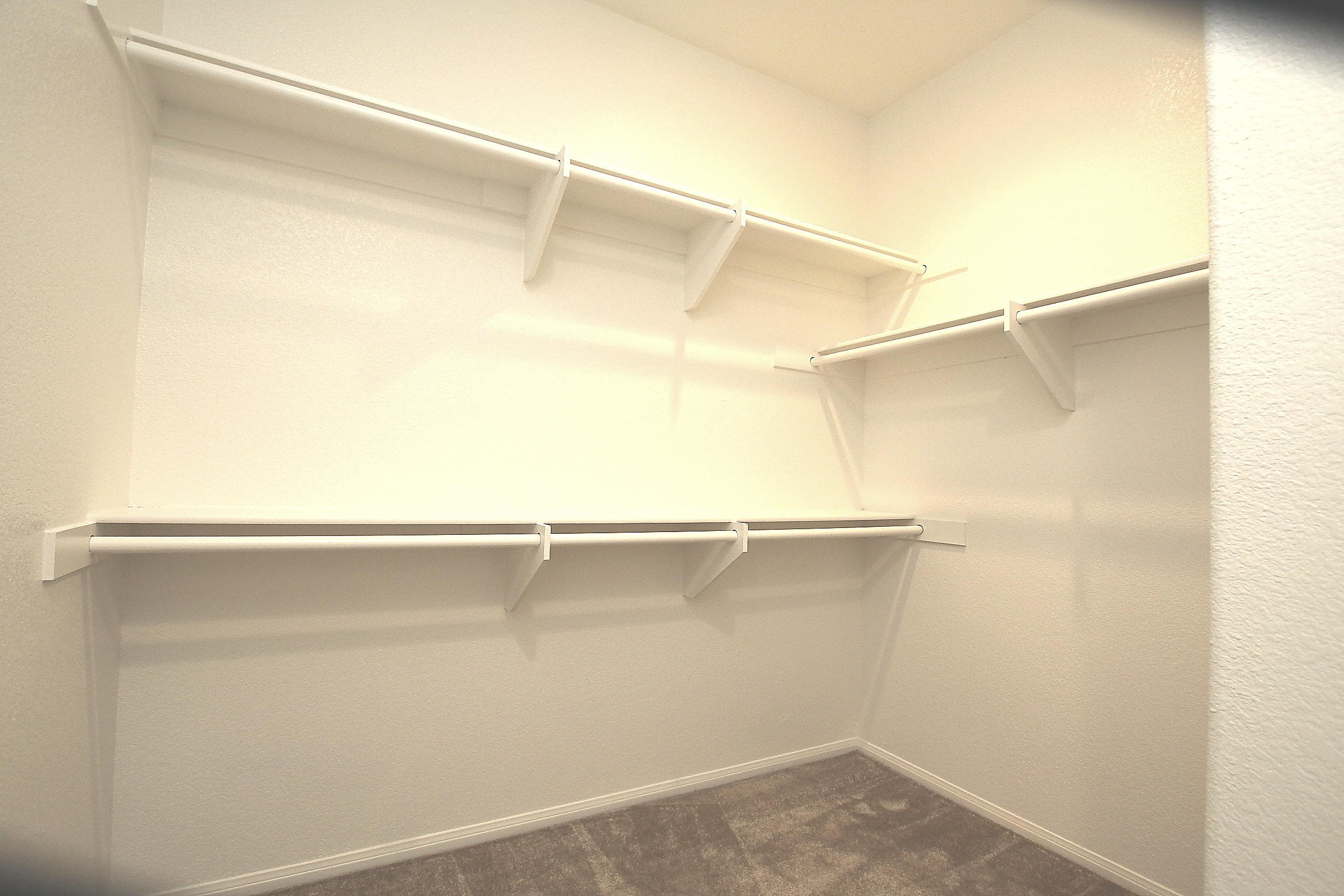 2104 Avenue J7 W Lancaster Ca West Lancaster, CA 93536 - Photo 8 of 18 a view of a room with racks on the wall