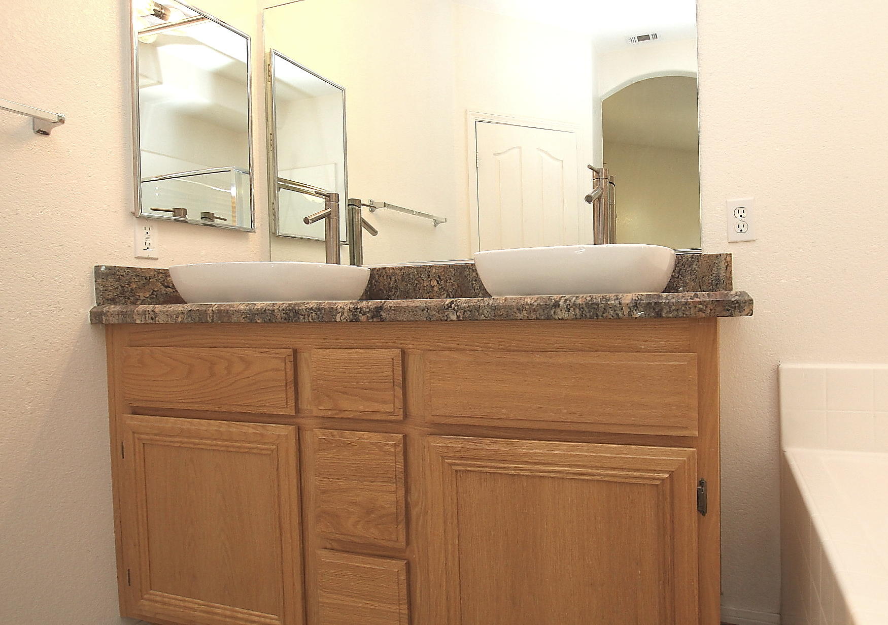 2104 Avenue J7 W Lancaster Ca West Lancaster, CA 93536 - Photo 10 of 18 a bathroom with a granite countertop sink and a mirror