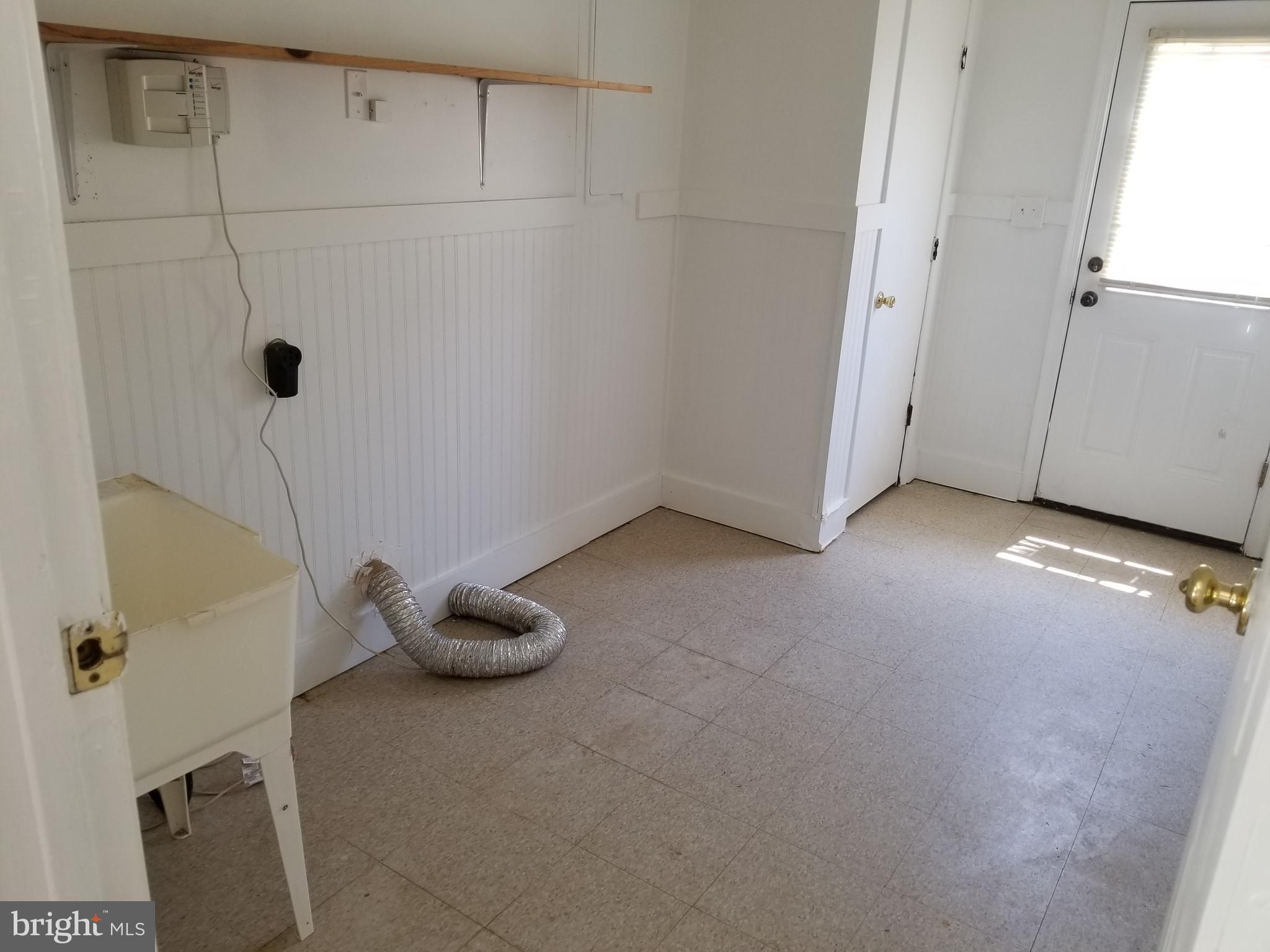 241 North Randolph Road Fredericksburg, VA 22405 - Photo 18 of 19 Laundry room off kitchen. Has a washer and dryer.