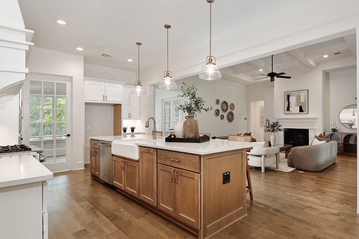 11709 Grand N Road Willis, TX 77378 - Photo 13 of 37 Premium finishes, features such as farmhouse apron-front sink and gold faucet ties together pendants, pulls. Fabulous walk-in chefs pantry through the multi-lite door.