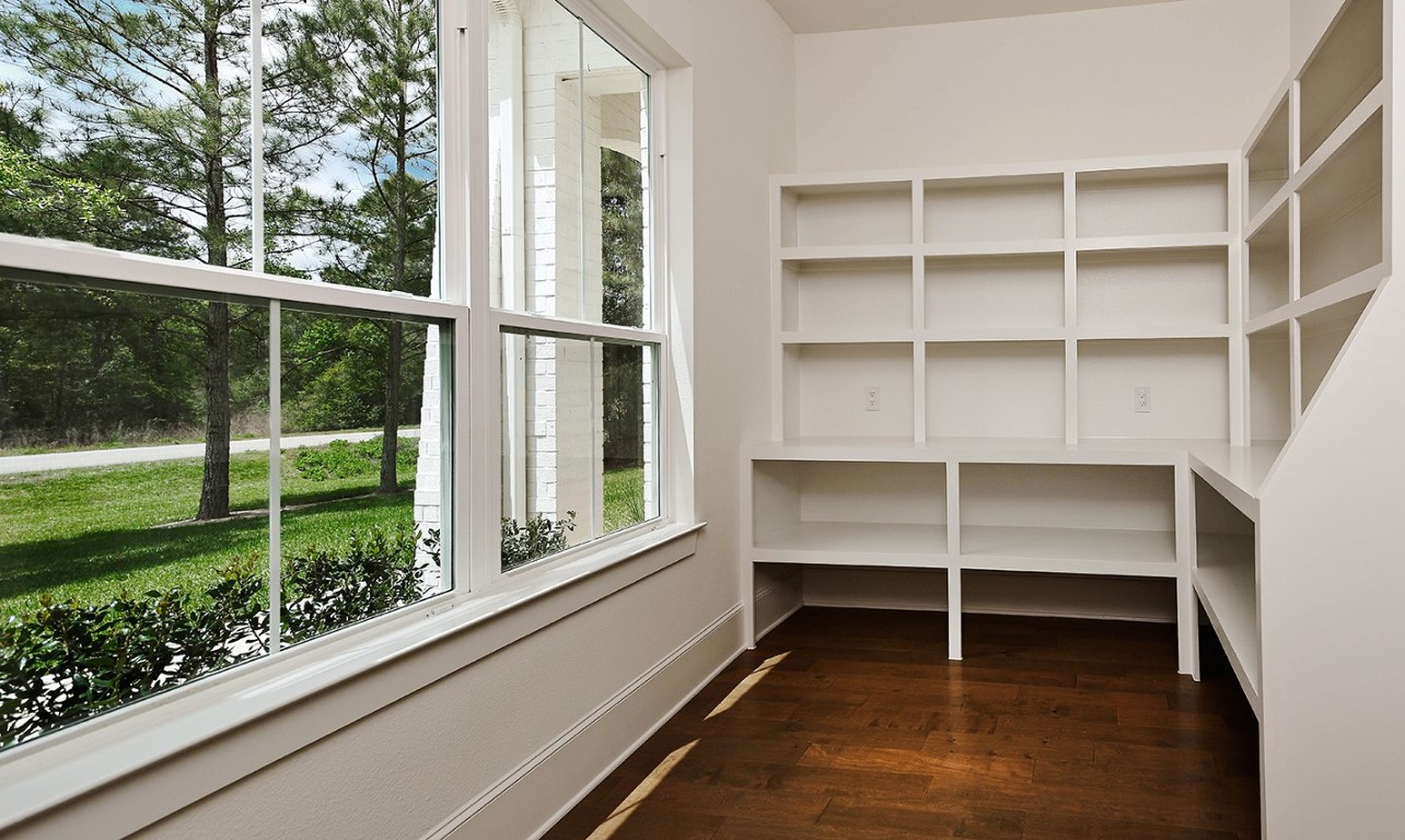 11709 Grand N Road Willis, TX 77378 - Photo 15 of 37 The custom chef's pantry includes built-in shelving and ample space for your kitchen countertop appliances-genius.