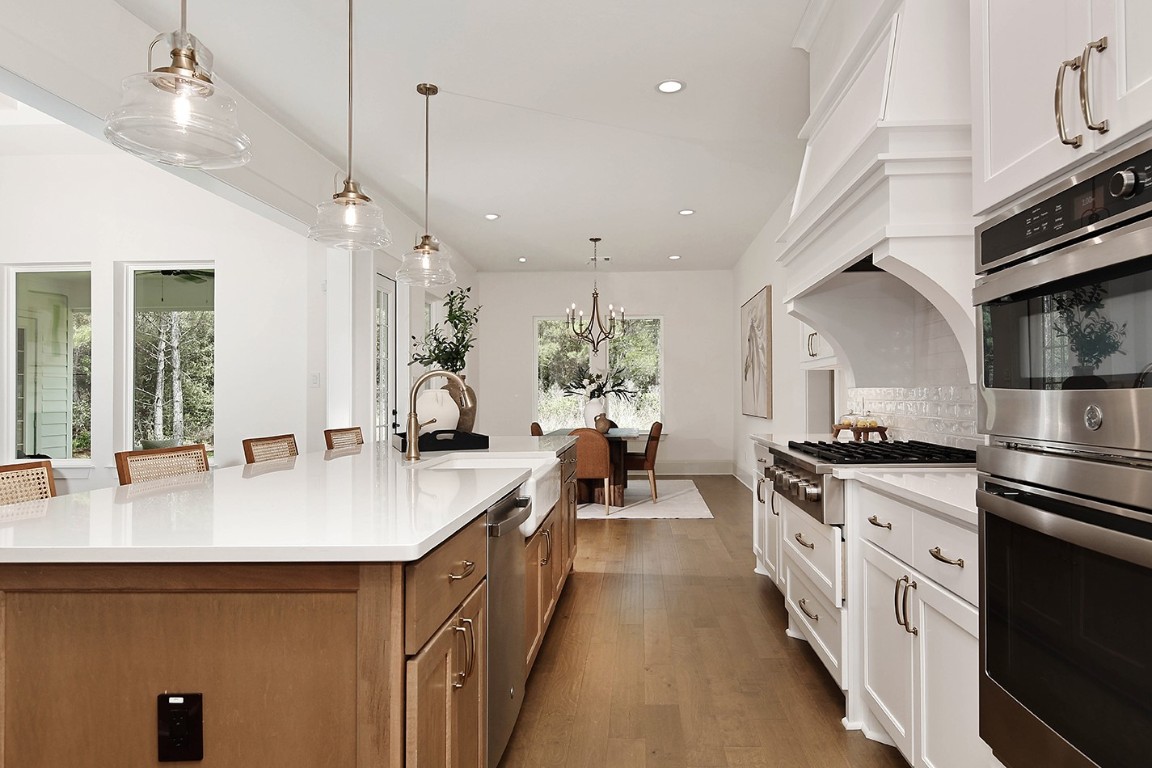 11709 Grand N Road Willis, TX 77378 - Photo 16 of 37 The welcoming feel, great design, will inspire you and make your experience enjoyable beyond measure - surrounded in beauty, and family and friends in open dining/living rooms.