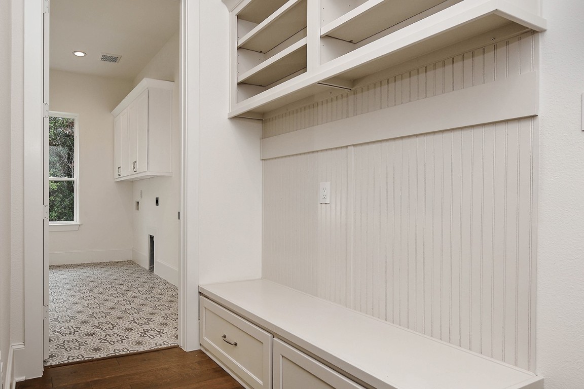 11709 Grand N Road Willis, TX 77378 - Photo 19 of 37 Custom drop zone for shoes, gear, bags, everything, conveniently located through garage door entry and adjacent to laundry room.