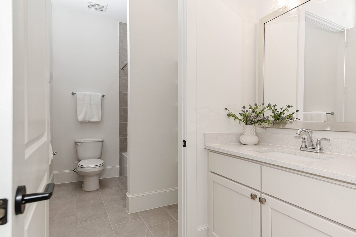11709 Grand N Road Willis, TX 77378 - Photo 26 of 37 Bathroom 2 has separate vanities for each bedrooms 2 and 3 with shared water closet for toilet/tub/shower.