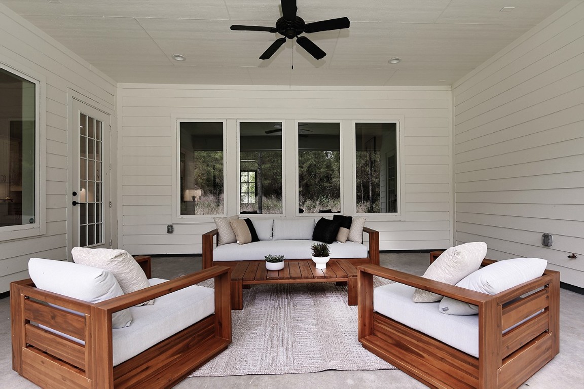 11709 Grand N Road Willis, TX 77378 - Photo 28 of 37 Coveted outdoor lanai for enjoying the outdoors in shaded comfort.