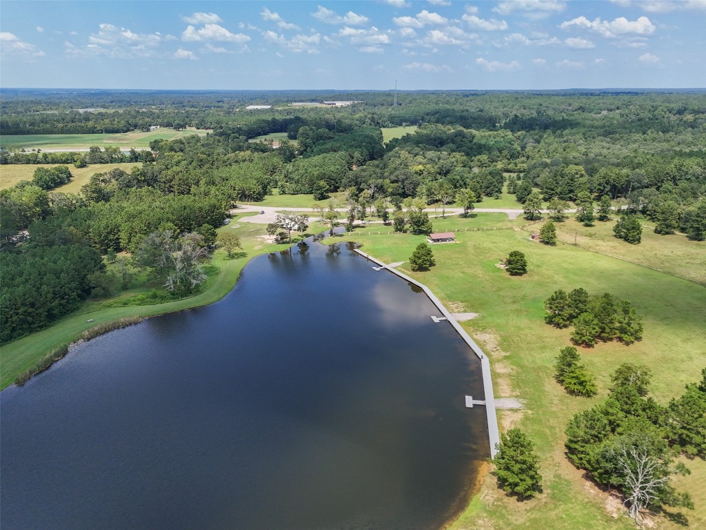 11709 Grand N Road Willis, TX 77378 - Photo 35 of 37 The lake is stocked with bass and includes three fishing docks for easy access.