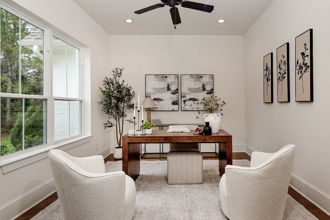 11709 Grand N Road Willis, TX 77378 - Photo 6 of 37 Bright, modern home office has privacy doors and ample natural lighting creating a welcoming and functional workspace.