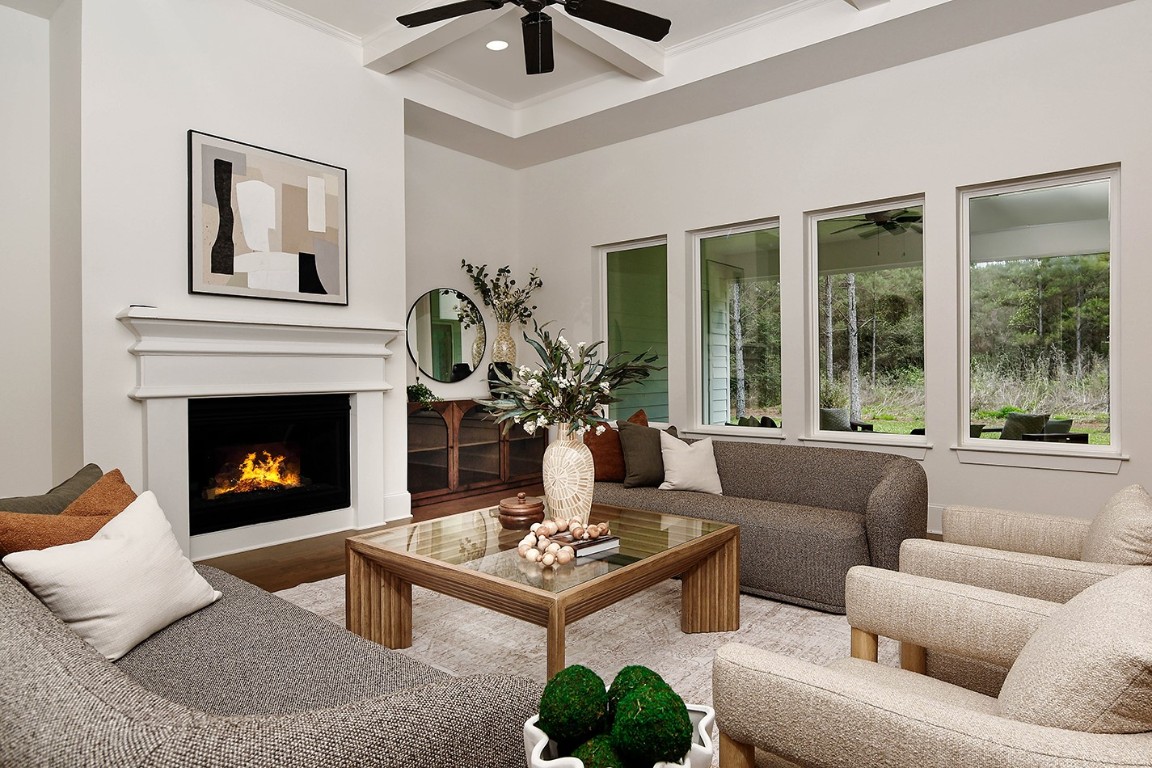 11709 Grand N Road Willis, TX 77378 - Photo 8 of 37 This cozy fireplace and neutral tones create a warm, inviting atmosphere with lovely views.