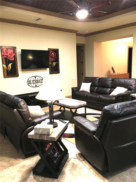 6656 Southwest 179th Ave Road Dunnellon, FL 34432 - Photo 11 of 43 a living room with furniture and a flat screen tv