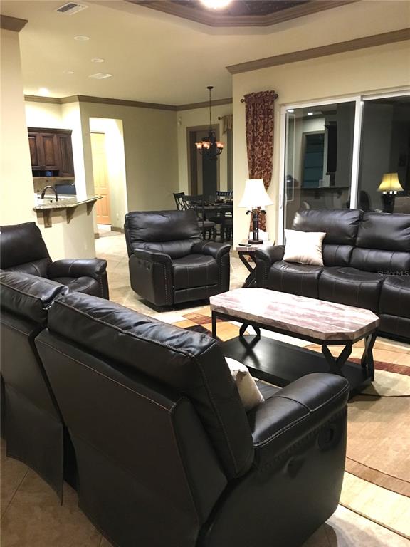 6656 Southwest 179th Ave Road Dunnellon, FL 34432 - Photo 12 of 43 a living room with furniture and a flat screen tv