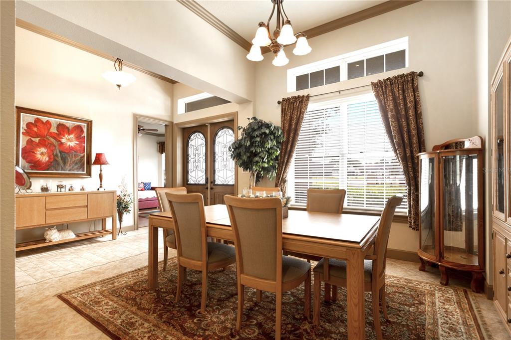 6656 Southwest 179th Ave Road Dunnellon, FL 34432 - Photo 15 of 43 a view of a dining room with furniture window and wooden floor