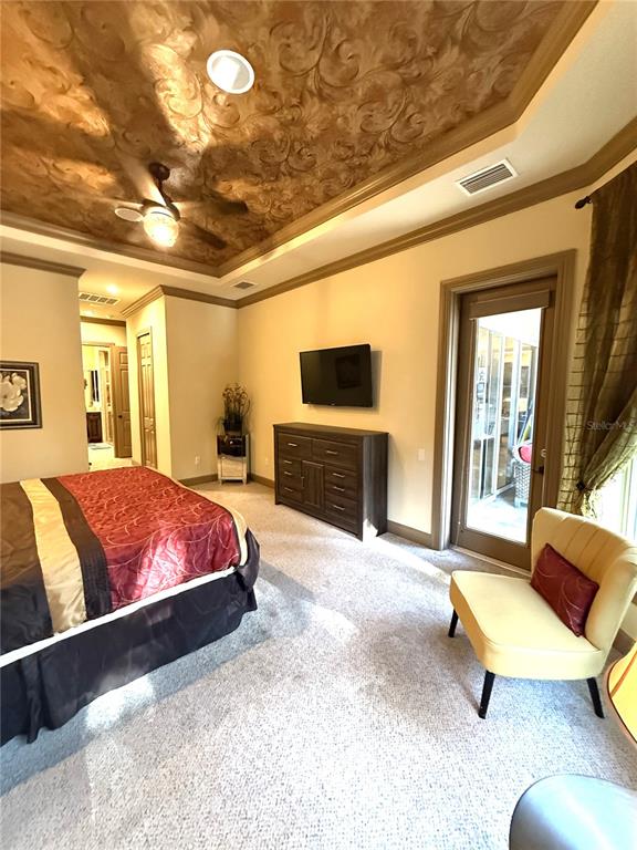 6656 Southwest 179th Ave Road Dunnellon, FL 34432 - Photo 20 of 43 a spacious bedroom with a bed and a couch