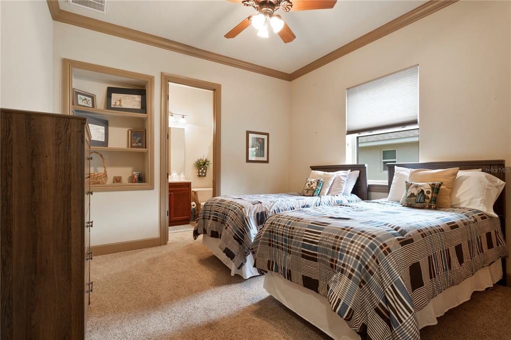 6656 Southwest 179th Ave Road Dunnellon, FL 34432 - Photo 28 of 43 a bedroom with a bed and a chandelier