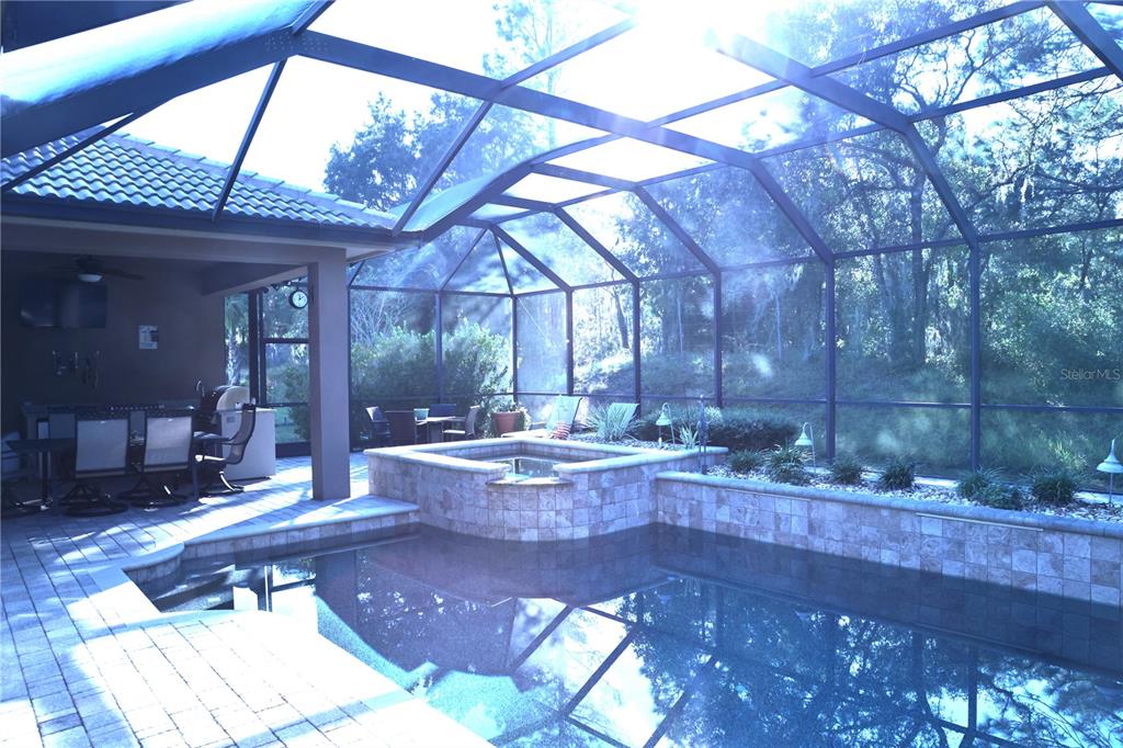 6656 Southwest 179th Ave Road Dunnellon, FL 34432 - Photo 32 of 43 a view of living room kitchen with stainless steel appliances wooden floor and refrigerator