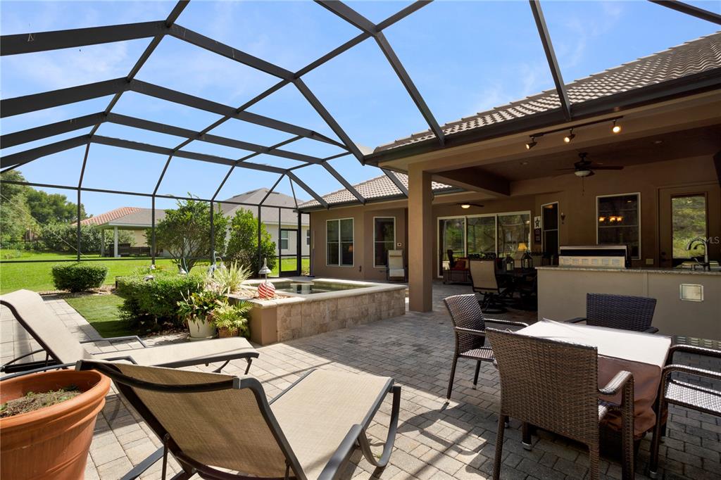 6656 Southwest 179th Ave Road Dunnellon, FL 34432 - Photo 33 of 43 a view of a patio with table and chairs under an umbrella