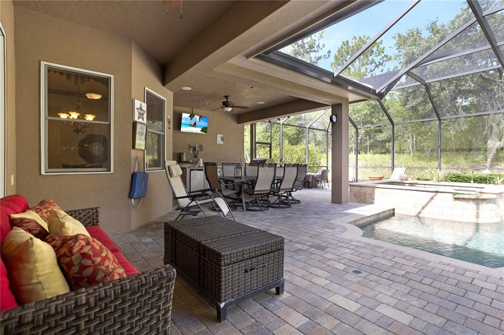 6656 Southwest 179th Ave Road Dunnellon, FL 34432 - Photo 34 of 43 a living room with furniture and a large window