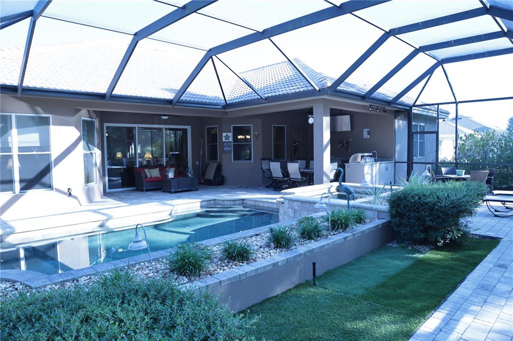 6656 Southwest 179th Ave Road Dunnellon, FL 34432 - Photo 35 of 43 a front view of a house with a porch and furniture