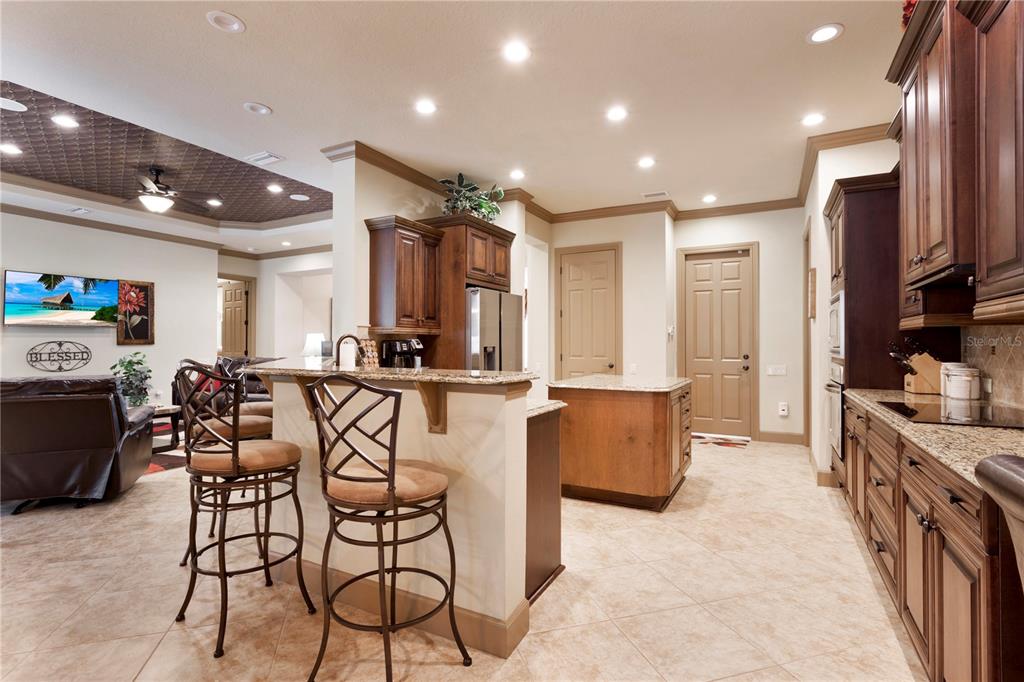 6656 Southwest 179th Ave Road Dunnellon, FL 34432 - Photo 5 of 43 a room with stainless steel appliances kitchen island granite countertop a sink and cabinets