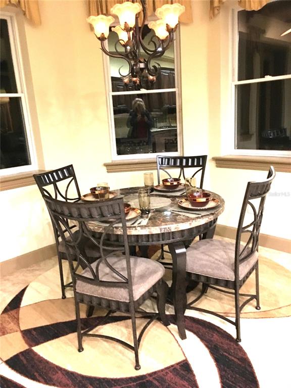 6656 Southwest 179th Ave Road Dunnellon, FL 34432 - Photo 7 of 43 a view of a dining room with furniture and window