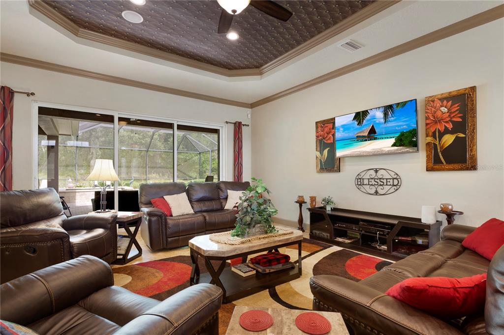 6656 Southwest 179th Ave Road Dunnellon, FL 34432 - Photo 10 of 43 a living room with furniture a rug and a large window