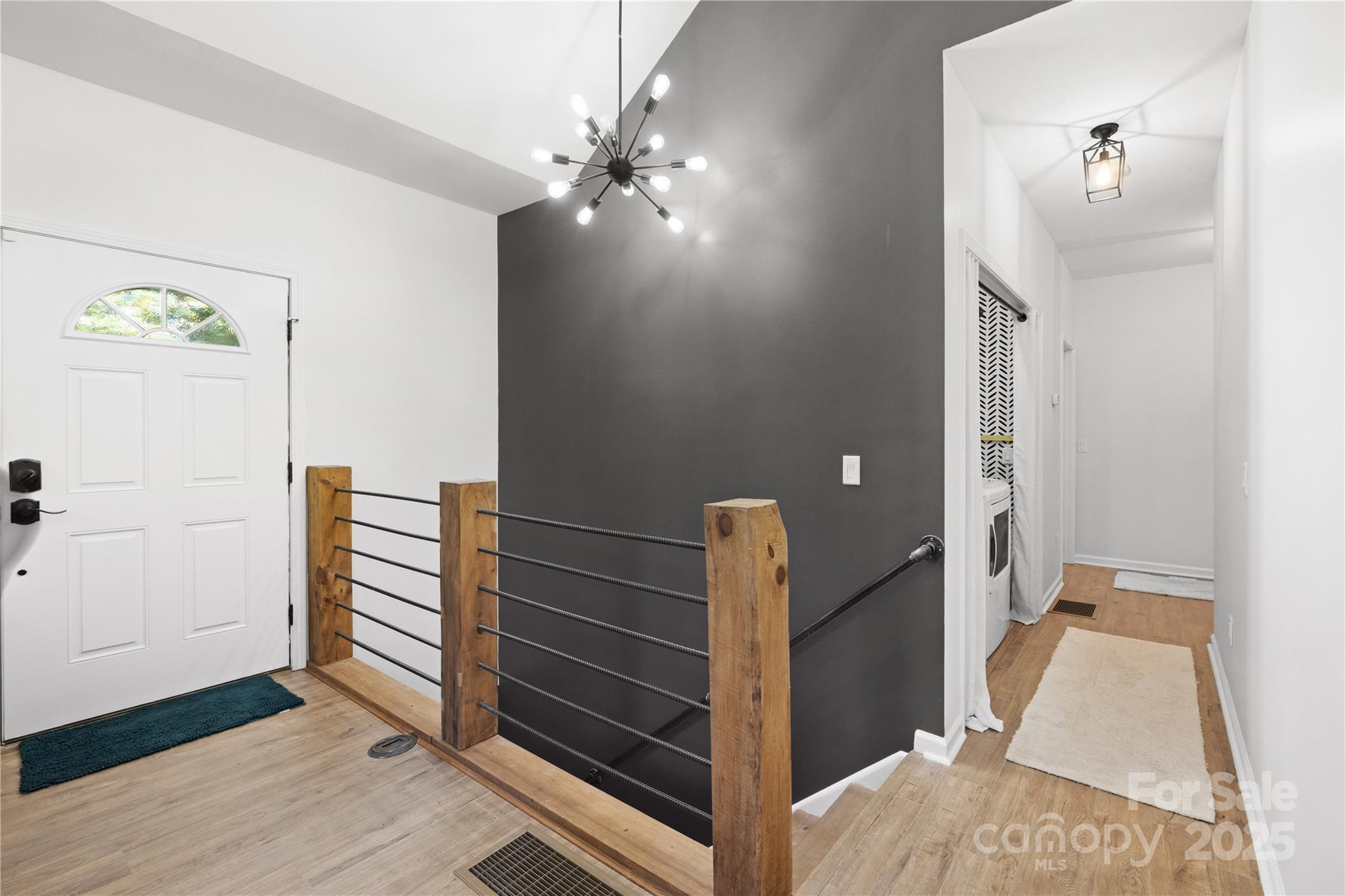 1308 Bell Mountain Road Zirconia, NC 28790 - Photo 12 of 42 a view of a hallway with wooden floor and staircase