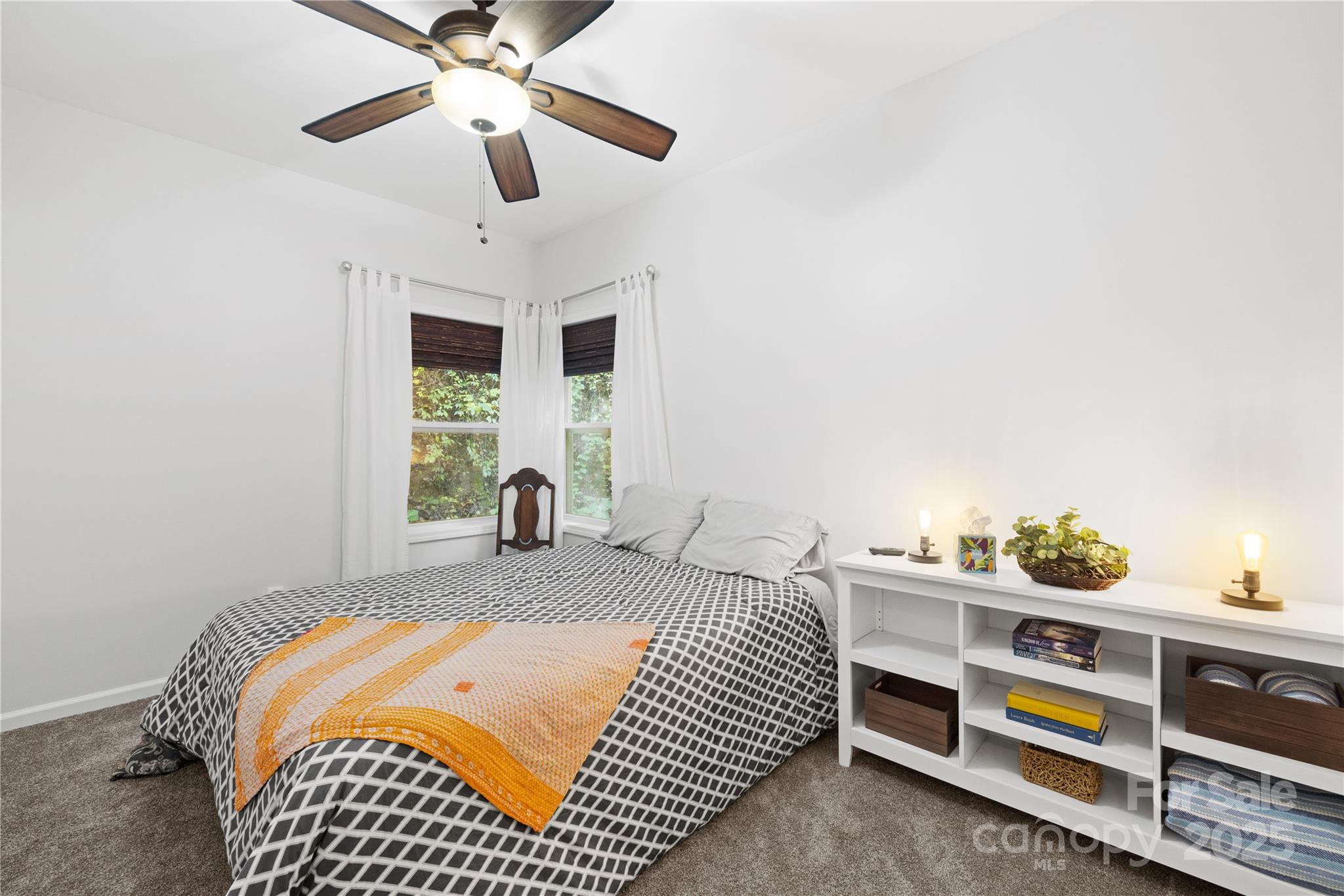 1308 Bell Mountain Road Zirconia, NC 28790 - Photo 16 of 42 a bedroom with bed and window