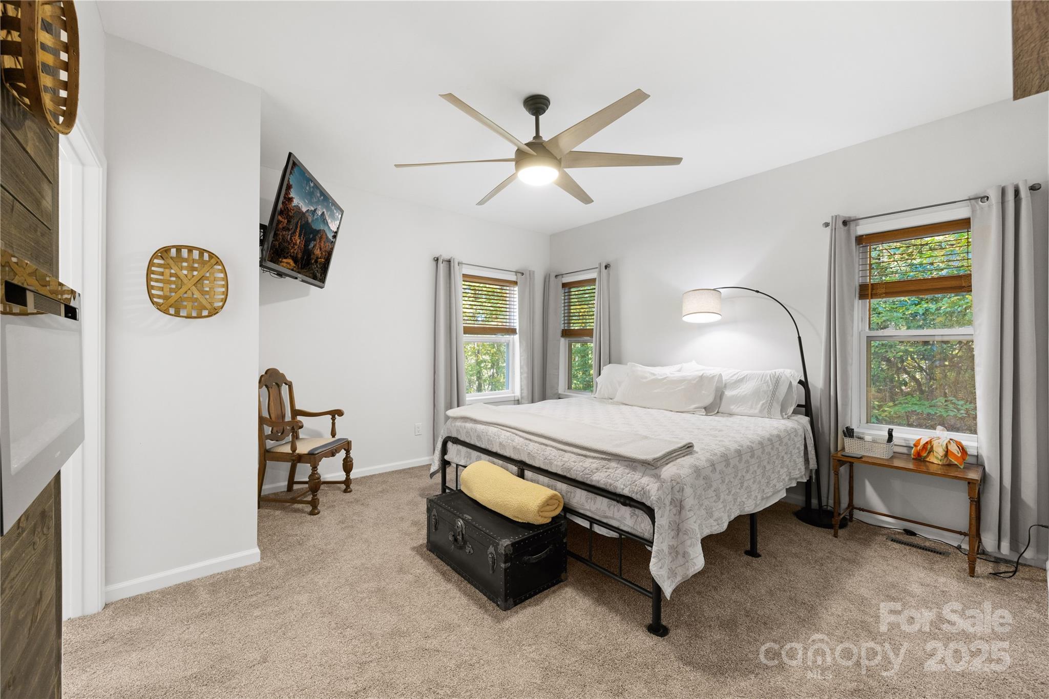 1308 Bell Mountain Road Zirconia, NC 28790 - Photo 18 of 42 a bedroom with a bed and a window