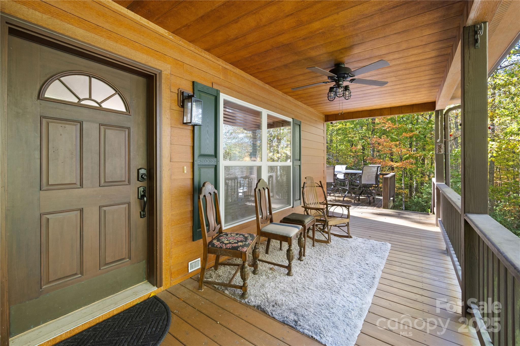 1308 Bell Mountain Road Zirconia, NC 28790 - Photo 2 of 42 a living room with furniture and a large window