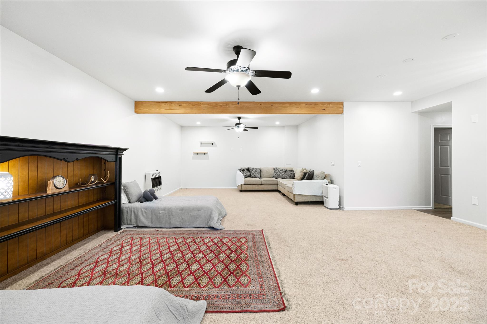 1308 Bell Mountain Road Zirconia, NC 28790 - Photo 25 of 42 a bedroom with furniture and a flat screen tv