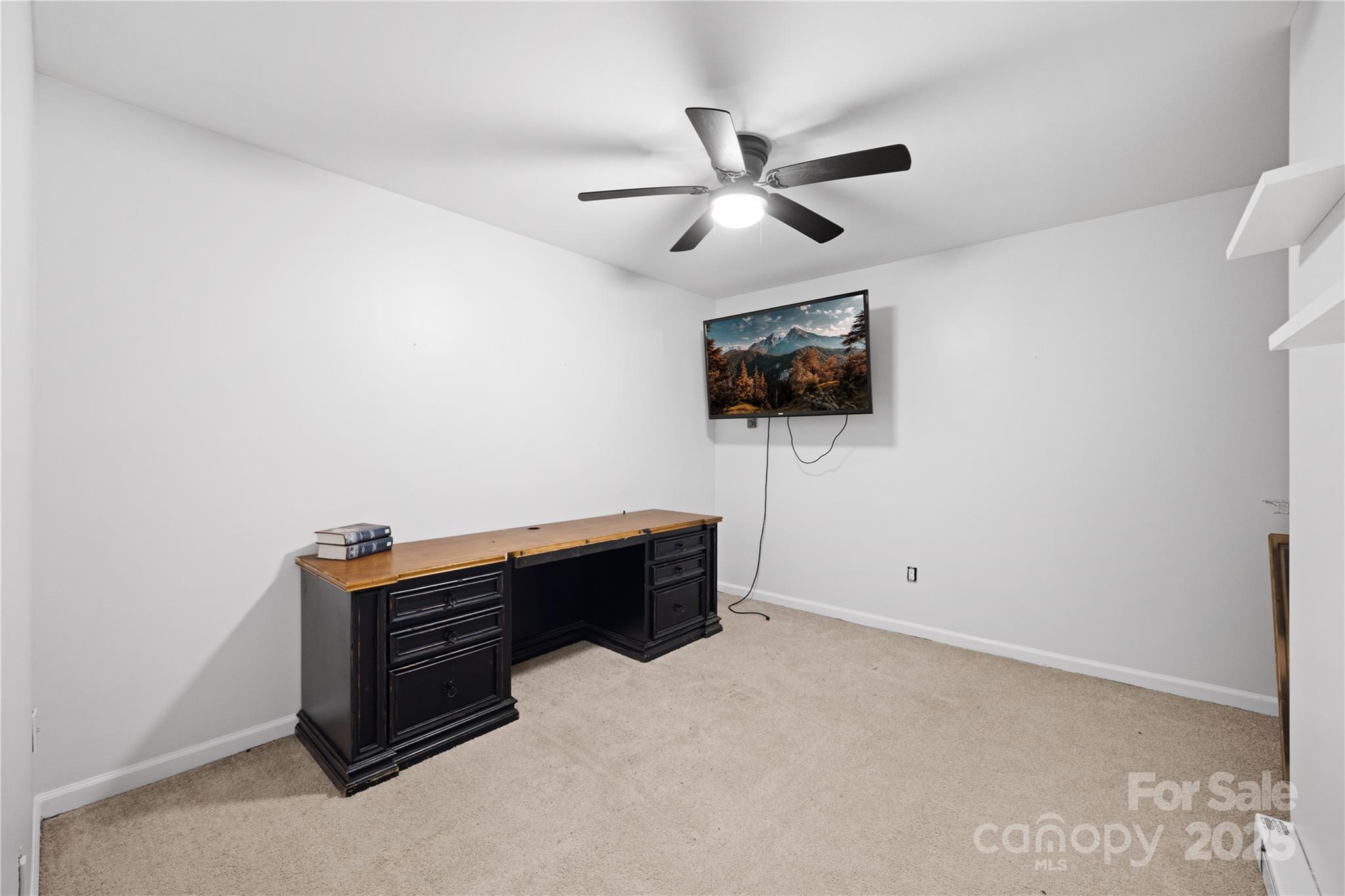 1308 Bell Mountain Road Zirconia, NC 28790 - Photo 28 of 42 a room with furniture and flat screen tv