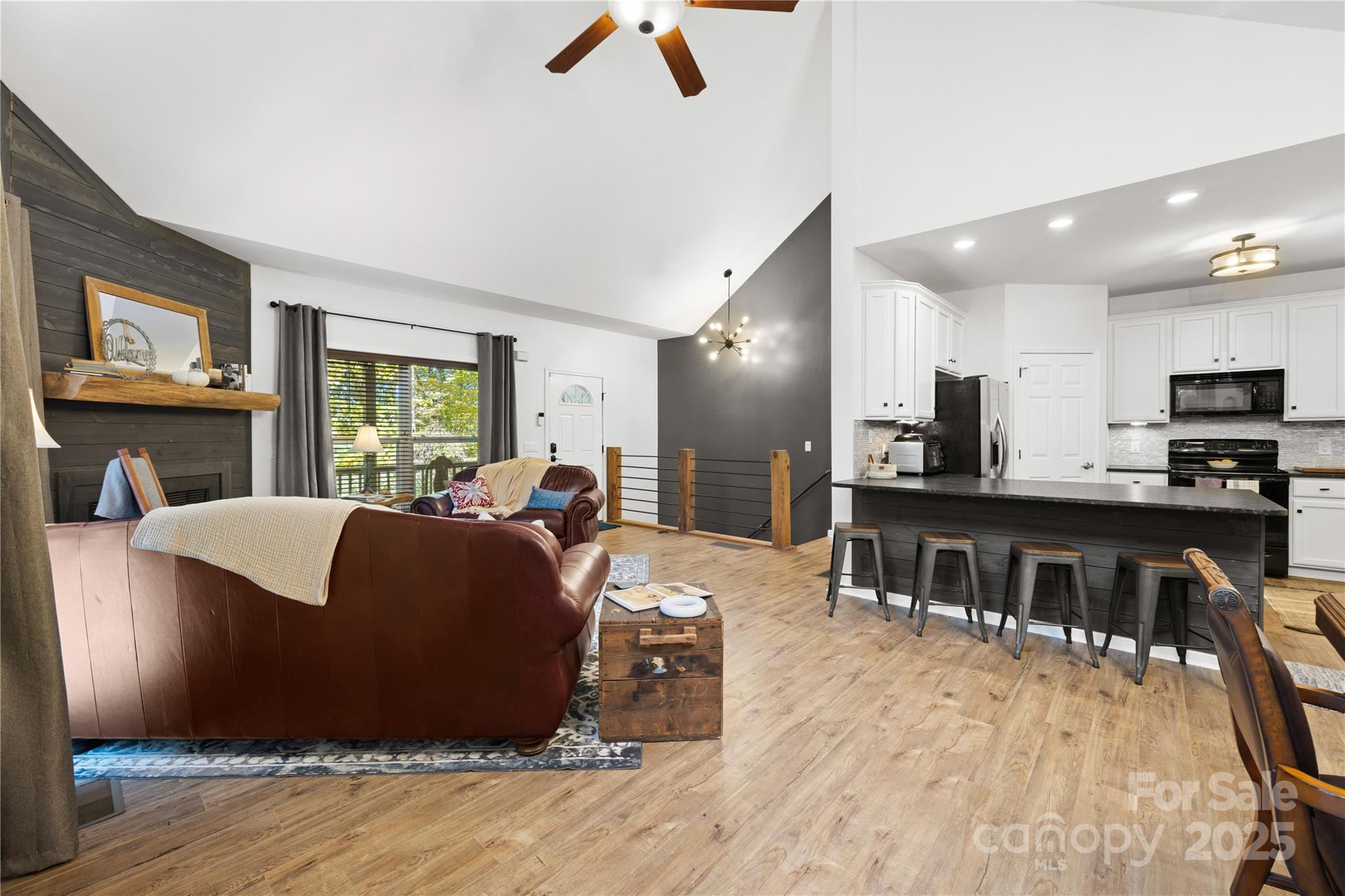 1308 Bell Mountain Road Zirconia, NC 28790 - Photo 6 of 42 a living room with furniture and a wooden floor