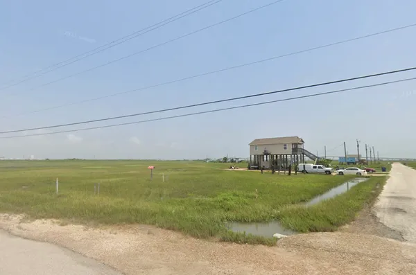 a view of a golf course with a lake