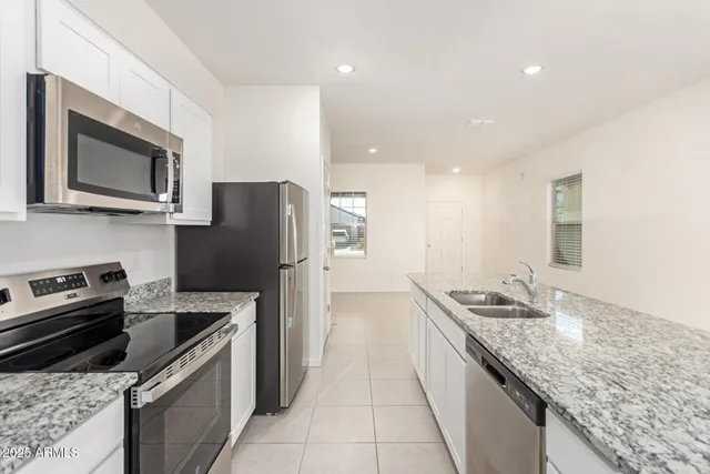 a kitchen with a stove microwave and refrigerator