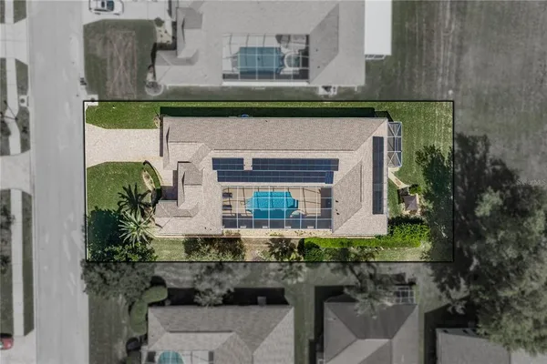 an aerial view of a house with a lake view