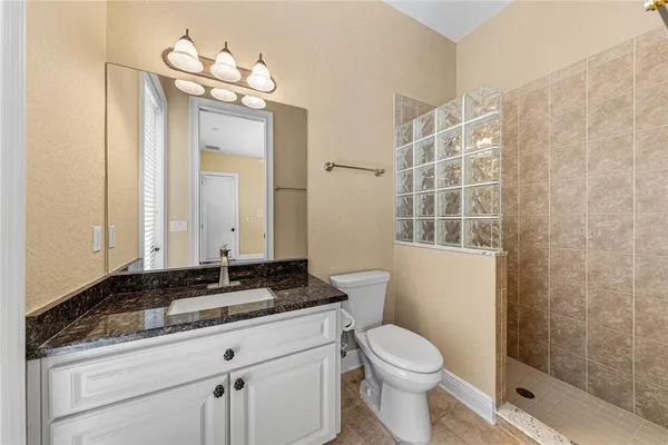 an aerial view of a residential houses with outdoor space and street view