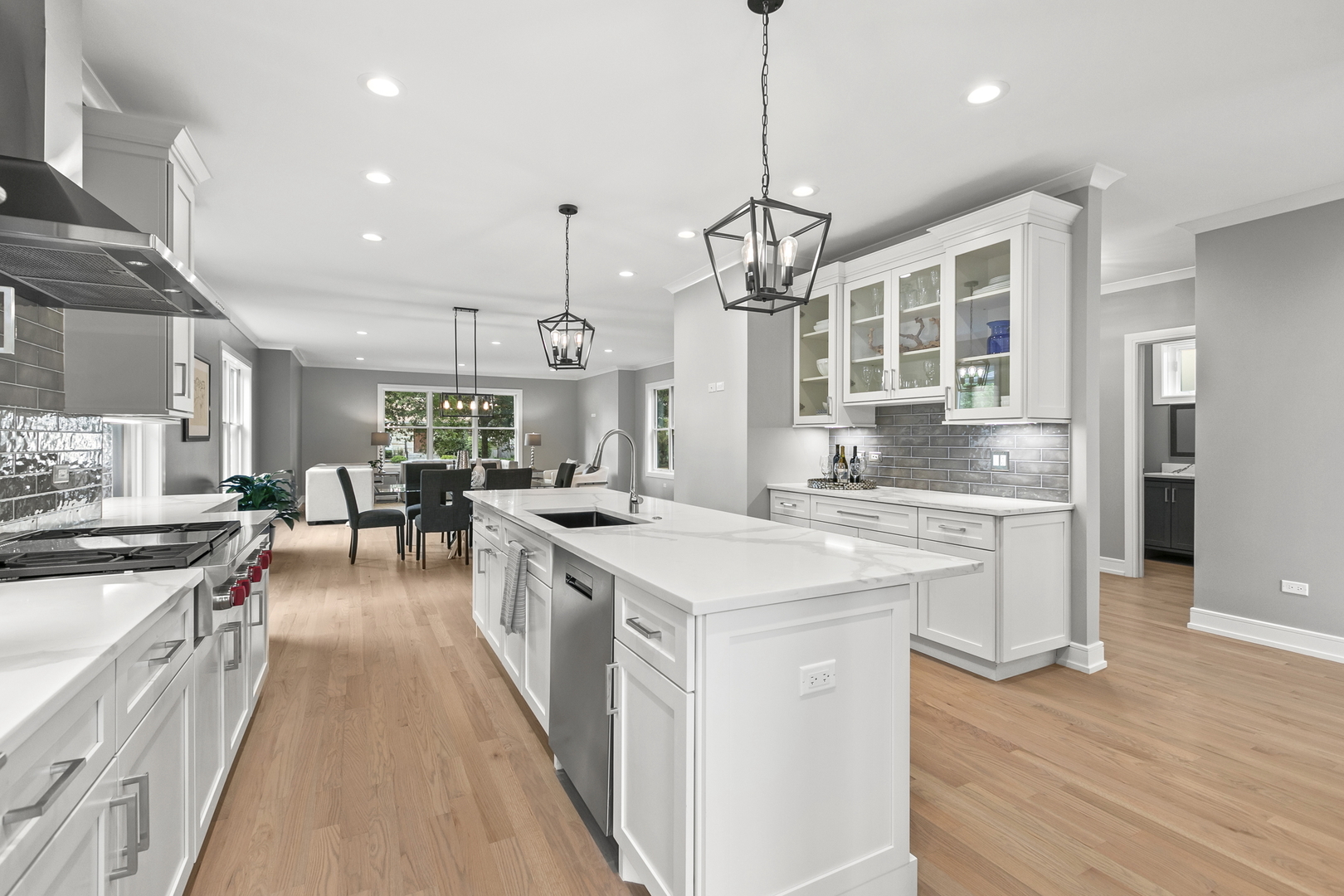 220 Spring Avenue Naperville, IL 60540 - Photo 13 of 52 a large kitchen with stainless steel appliances granite countertop a lot of counter space and wooden floors