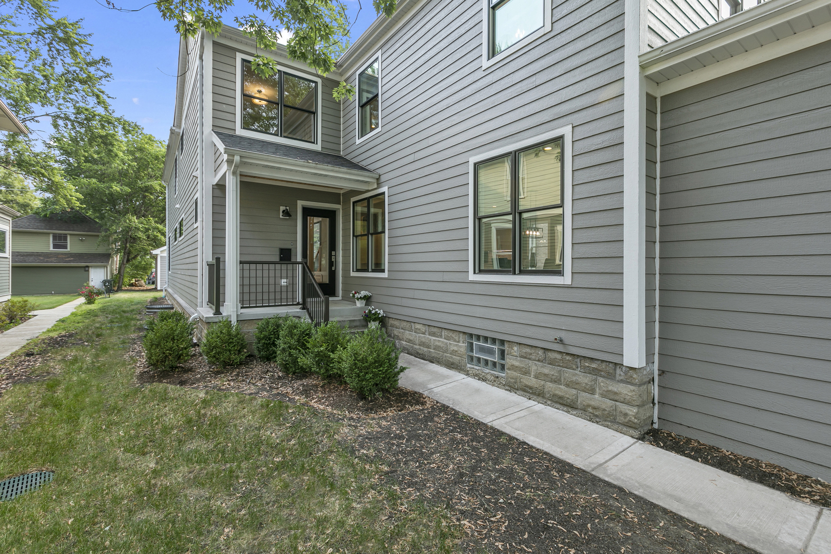 220 Spring Avenue Naperville, IL 60540 - Photo 2 of 52 a front view of a house with garden