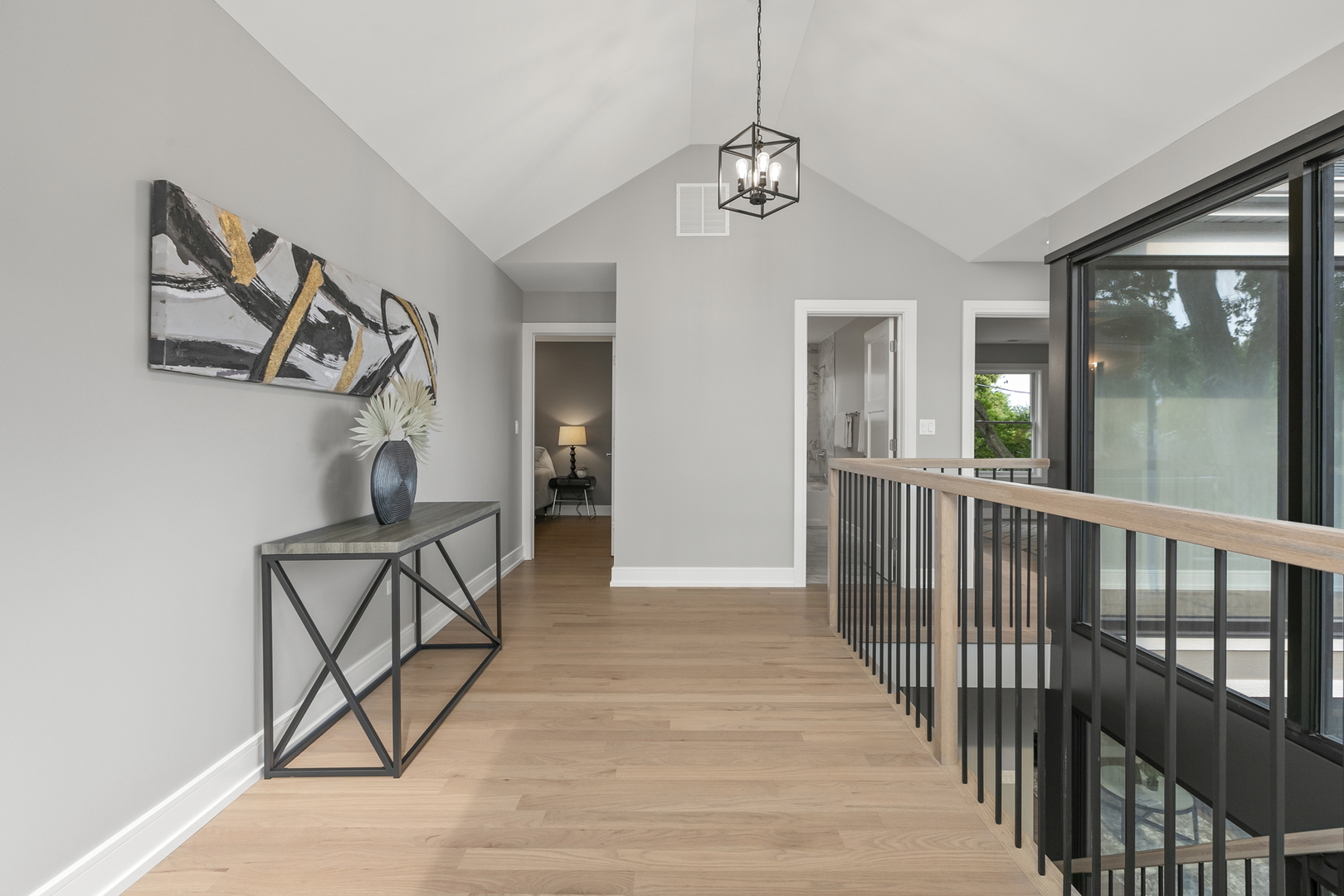 220 Spring Avenue Naperville, IL 60540 - Photo 25 of 52 a view of a hallway with wooden floor and stairs