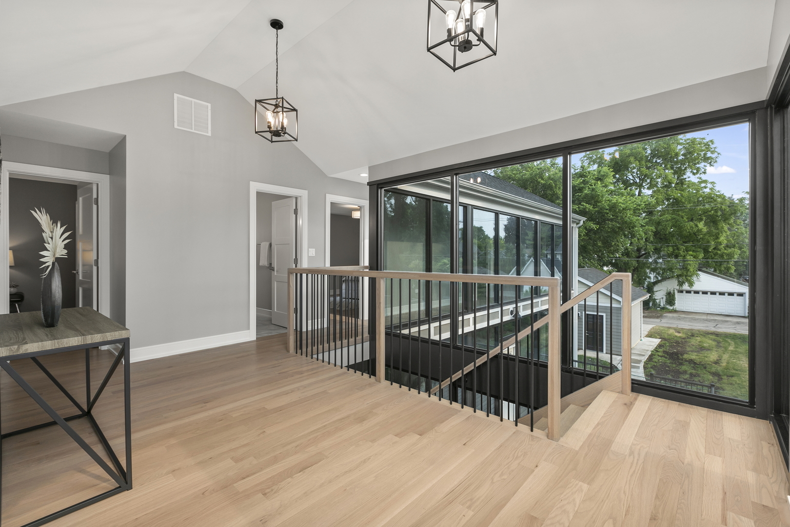 220 Spring Avenue Naperville, IL 60540 - Photo 26 of 52 a view of a room with wooden floor and windows