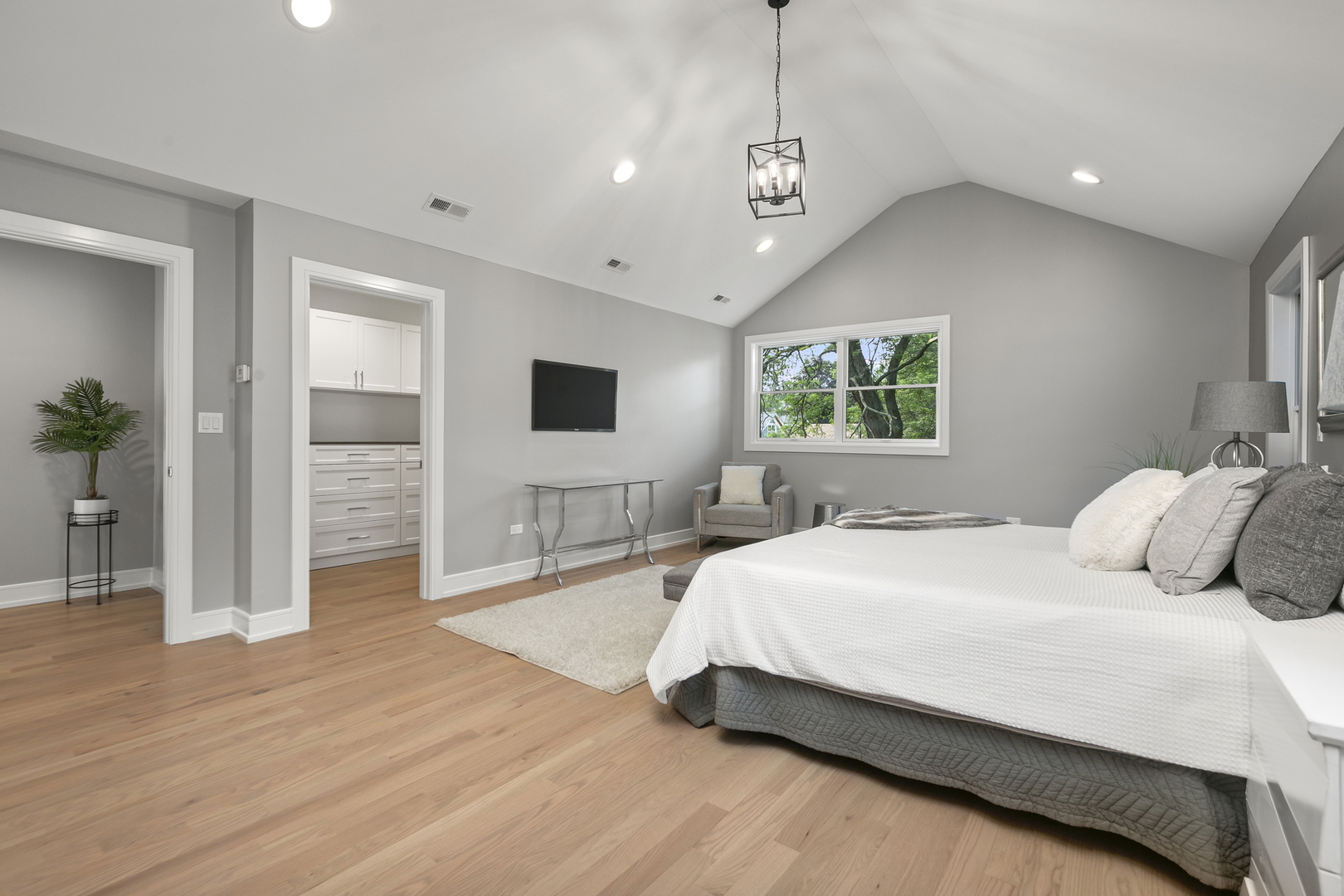 220 Spring Avenue Naperville, IL 60540 - Photo 29 of 52 a bedroom with a large bed and a window